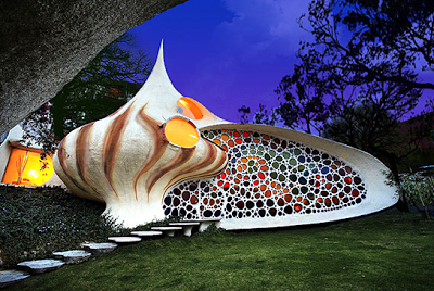 House shaped like sea shell with stained glass