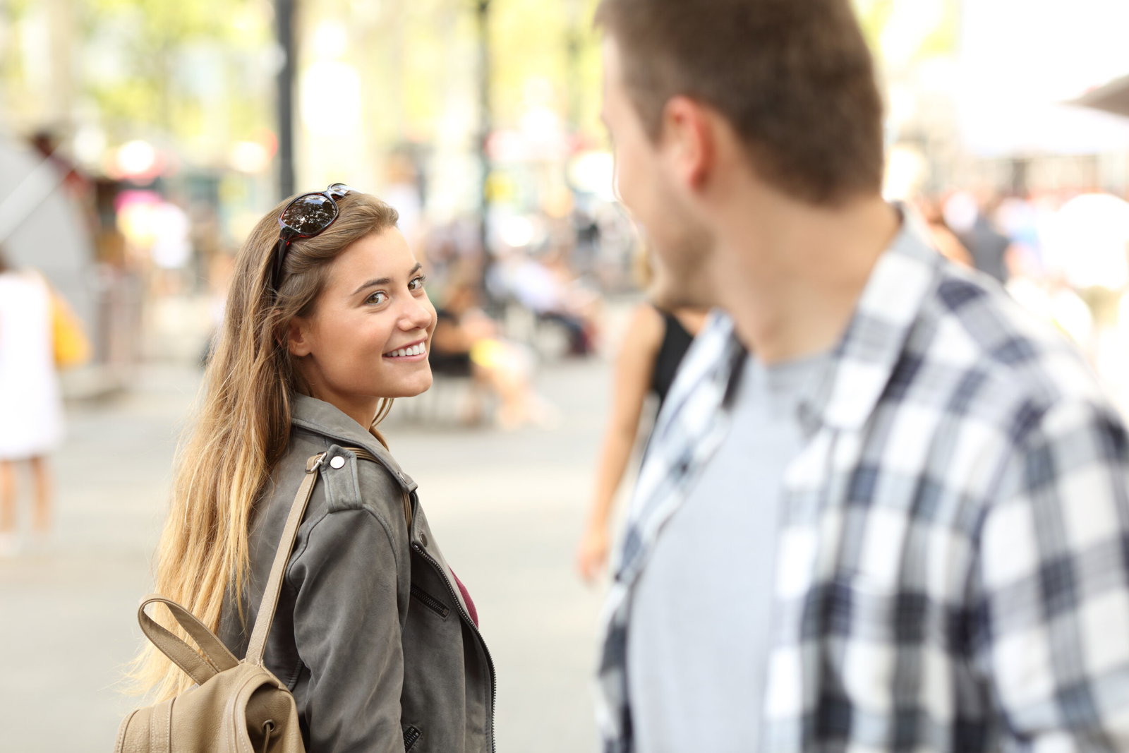 Girl smiling at stranger on the street