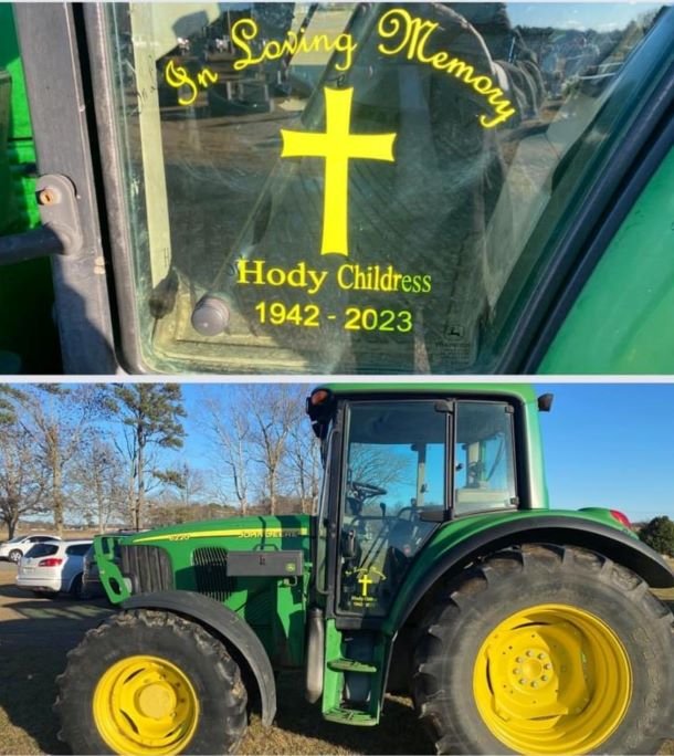A green and yellow tractor shares a message: In Loving Memory of Hody Childress.