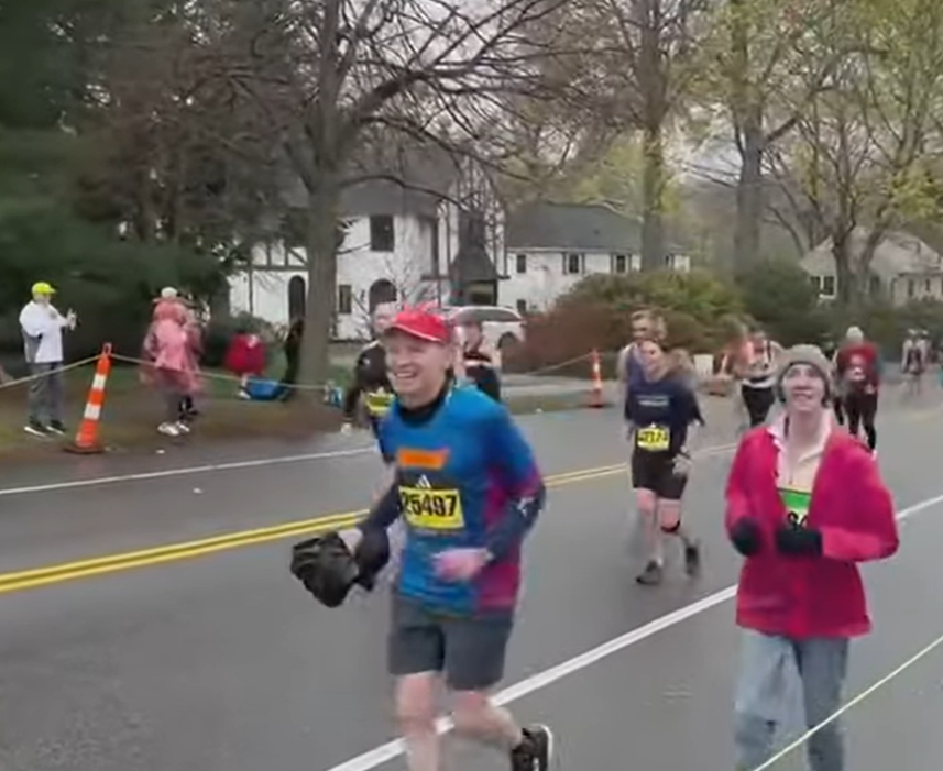Rachel Foster and Tim Altendorf running the Boston Marathon in 2023.